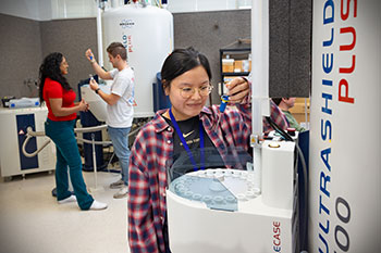 Photo of a student working on a machine. Links to Gifts by Estate Note
