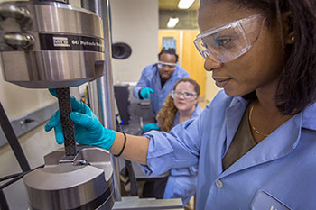 Photo of a professor working on a machine. Link to Life Stage Gift Planner Ages 45-65 Situations.