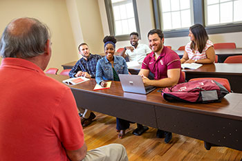 Photo of students in class. Links to Gifts of Real Estate